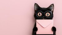 Black cat wearing round glasses holding pink envelope against pastel pink background. Cute pet mail delivery concept for greeting cards and announcements.