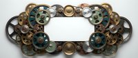 Ornate steampunk frame made of vintage brass and copper gears, cogs and mechanical parts on white background. Industrial Victorian design element.
