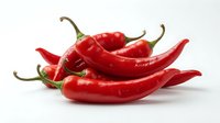 Red hot chili peppers isolated on white background, fresh spicy ingredients for cooking, food photography for culinary design and recipe content.