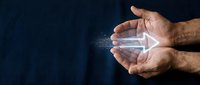 Man holding glowing arrow pointing right, symbolizing forward direction, progress, and digital transformation for business and technology concepts.