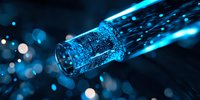 Glowing fiber optic cable emitting blue light streams against dark background with bokeh effects, showcasing digital connectivity and data transmission technology.