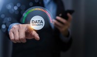 Businessman touching digital data security gauge interface with colorful progress indicator showing cybersecurity protection levels and risk assessment.