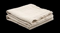 Folded stack of neutral linen textiles with frayed edges, isolated on transparent background. Ready for home decor, interior design, product mockups, t-shirt designs, and print-on-demand applications.