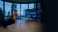 Engineer or technician with dark skin tone interacting with holographic digital interface displaying technical schematics and data analytics in modern office with city skyline view.