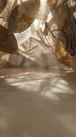 Sheer fabrics hanging in sunlight casting shadows on sandy ground, creating an ethereal atmosphere for textile, fashion, and artistic projects.
