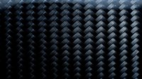 Dark metallic herringbone pattern with dimensional tiles creating depth and shadow. Seamless background suitable for modern design, technology, corporate branding, and contemporary digital projects.