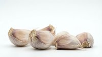 Garlic cloves isolated on white background, ready for culinary design, cooking websites, recipe blogs, food packaging and restaurant menus.