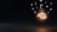 Glowing lightbulb with brain filament surrounded by floating innovation icons on dark background representing creative thinking and bright ideas.