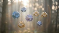 Colorful geometric crystal ornaments hanging on strings with soft bokeh lights background for holiday decoration and festive interior design projects.