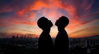 Two people silhouettes facing each other against dramatic sunset sky over city skyline. Romantic couple moment during golden hour for relationship concepts.