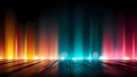 Dramatic multicolored light beams shine upward from wooden floor creating atmospheric stage or dance floor background with vibrant orange, blue and pink illumination.