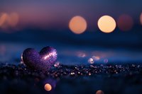 Purple glittery heart on sparkling surface with dreamy bokeh lights background creating romantic Valentine's Day atmosphere for love themed designs.