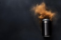 Black aluminum can with explosive orange powder burst against dark background, dynamic motion capture of particles and dust in studio lighting conditions.