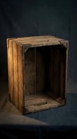 Vintage wooden crate with rustic weathered finish on dark background for storage and rustic decor projects.