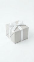 Elegant gray gift box with white satin ribbon bow isolated on white background for holiday celebrations, birthdays, and special occasions.