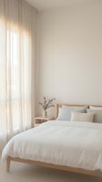Minimalist bedroom interior with wooden bed frame, white bedding, sheer curtains and neutral beige walls creating serene sleeping space for home decor.