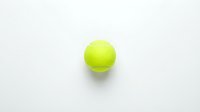 Bright neon yellow tennis ball isolated on white background, ready for sports design, marketing materials, and athletic promotional content.