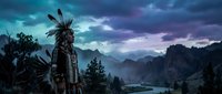 Native American warrior in traditional feathered headdress standing on mountain cliff overlooking misty valley at dramatic twilight with purple clouds.