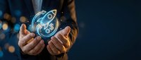 Businessman holding glowing rocket hologram symbolizing startup launch, innovation and business growth in modern corporate environment.
