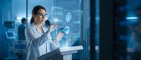 Professional businesswoman in glasses interacting with futuristic holographic interface displaying data analytics and charts in modern office environment.
