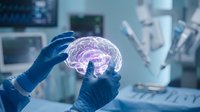 Medical professional examining holographic brain model in modern surgical operating room for neurological research and diagnosis.