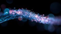 Glowing blue and pink light trail with sparkling bokeh effects against dark background creates magical atmosphere for festive designs and celebrations.
