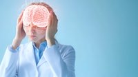 Caucasian woman in medical uniform experiencing headache with glowing brain visualization overlay against blue background, depicting neurological condition.