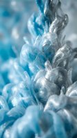 Frozen blue ice crystals with sparkling texture and cold winter frost formations creating abstract natural patterns for seasonal design projects.