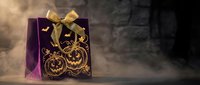Purple Halloween gift bag with golden pumpkin design and ribbon bow on dark atmospheric background with smoke effects for seasonal celebrations.