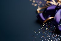 Purple satin ribbon bow with scattered gold glitter on dark background, festive holiday decoration with soft bokeh lights and copy space.