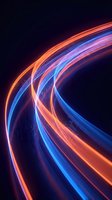 Glowing neon light trails in orange, blue, and pink curve dynamically against dark background, creating modern energy flow effect for tech and digital design projects.
