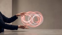 Professional businessman hands presenting glowing pink circular rings hologram representing connection, partnership and business collaboration concepts.