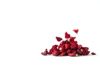 Dried red cranberries scattered in pile on white background, healthy natural snack ingredient isolated for food packaging and recipe design projects.