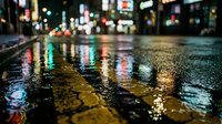 Wet city street at night with colorful neon light reflections on rain-soaked pavement, bokeh background, urban atmosphere.