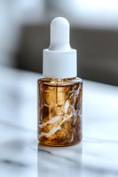 Amber glass dropper bottle with white cap on marble surface, containing swirling serum or essential oil. Clean cosmetic product photography for beauty and wellness.