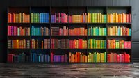 Colorful rainbow arrangement of books on dark wooden shelves creates striking visual display perfect for education, library, or bookstore interior design concepts.