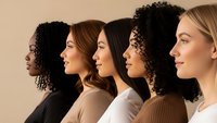 Diverse group of women in profile showing different ethnicities and hairstyles representing unity, diversity and inclusion in modern workplace or community.