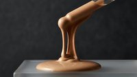 Woman's leg in bronze or gold metallic finish, isolated on dark background, suitable for luxury branding, fashion campaigns, and contemporary art projects.