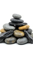 Stacked smooth stones and slate pieces in gray and golden tones arranged in balanced tower formation against white background for wellness and spa concepts.