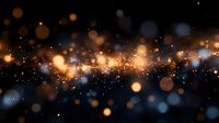Abstract golden bokeh lights with sparkling particles on dark background creating magical atmosphere for luxury design and celebration concepts.