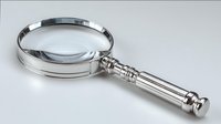 Elegant silver magnifying glass with ornate handle on white background, essential tool for detailed inspection and investigation.