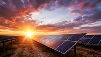 Solar panels in field at sunset, harnessing renewable energy from sun. Sustainable power generation technology for clean electricity production and environmental conservation.