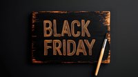 Black wooden sign with copper metallic lettering spelling Black Friday and chalk on dark background, seasonal shopping promotion concept.