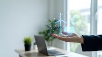 Wind turbine hologram glowing above open palm, symbolizing renewable energy innovation and sustainable technology solutions for business and environmental conservation.