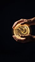 Male hands holding glowing golden orb with swirling light particles against black background, representing innovation, energy, future technology, and business success concepts.