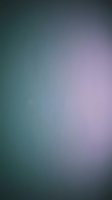 Abstract gradient background with smooth color transition from teal to purple and pink creating soft atmospheric effect for modern design projects.