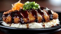 Japanese katsu curry rice bowl with crispy breaded pork cutlet glazed in rich brown sauce served over steamed white rice garnished with fresh herbs.