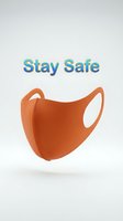 Orange reusable face mask with Stay Safe text on light background, promoting health protection and safety awareness.