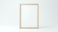 Empty wooden picture frame mockup on white background for artwork display and interior design projects.