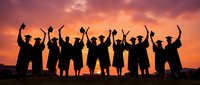 Group of diverse people celebrating with raised arms against dramatic sunset sky. Team success, achievement, unity and friendship concept for motivation.